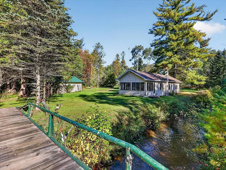 Michigan Riverfront Cabin for $50,000 With 22 Wooded Acres and Private Pere Marquette River Frontage