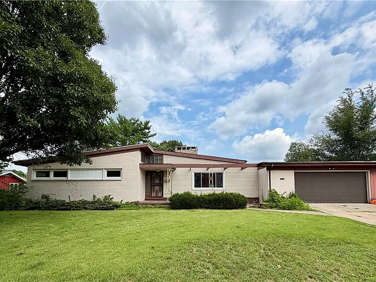 Danville, Illinois Home With 3 Bedrooms, a Spacious Backyard, Cozy Fireplace & Plenty of Potential