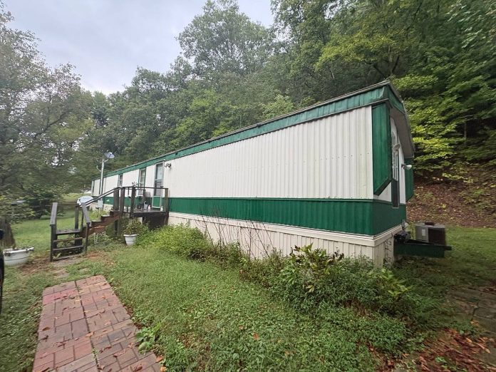Just $124,999! Tennessee Home on Nearly an Acre With Creek Views, 3 Bedrooms, a Workshop and Detached Garage!