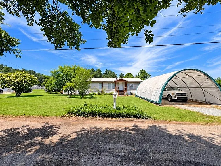 Affordable Mobile Retreat with Spacious Interiors, Greenhouse & New Metal Roof