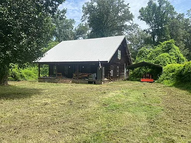 Rustic Louisiana Log Cabin on 1.1 Acres With Lake Access & a New Metal Roof