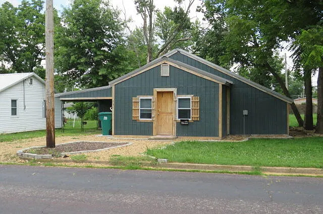 Charming Updated Bungalow With Beautiful Landscaping, Garage & a $99K Price Tag