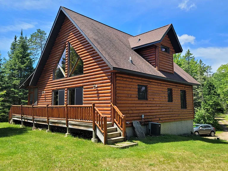 Wisconsin Lakefront Log Cabin for $64,900 With 3 Bedrooms, 3 Bathrooms and Shared Sandy Shoreline