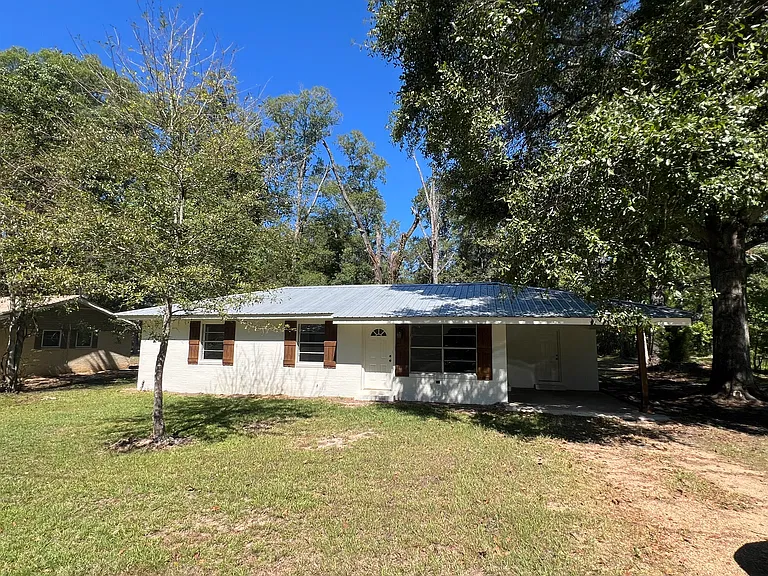 Affordable Columbia Brick Home on Half an Acre with Investment Potential