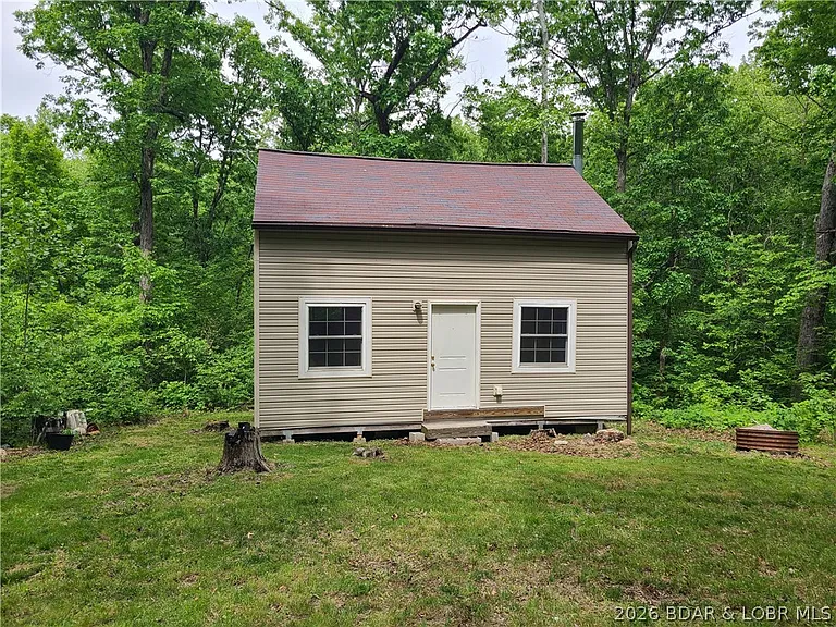 Missouri Cabin for Just $49,000 With 5 Wooded Acres, a Cozy Fireplace & Off-Grid Living