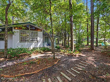 Peaceful Ocean Springs Retreat on Two Corner Lots with Bright Interiors & Coastal Character
