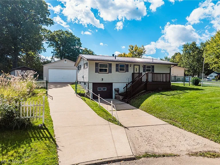 Updated Massillon Ranch With Walk-Out Basement, Garage and Outdoor Living