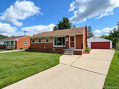 Charming Brick Ranch in Inkster With Spacious Yard and Detached Two-Car Garage