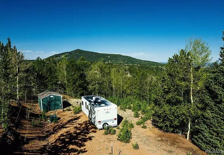 Colorado Creekside Land for $99,900 — 6.45 Wooded Acres Bordering Public Land