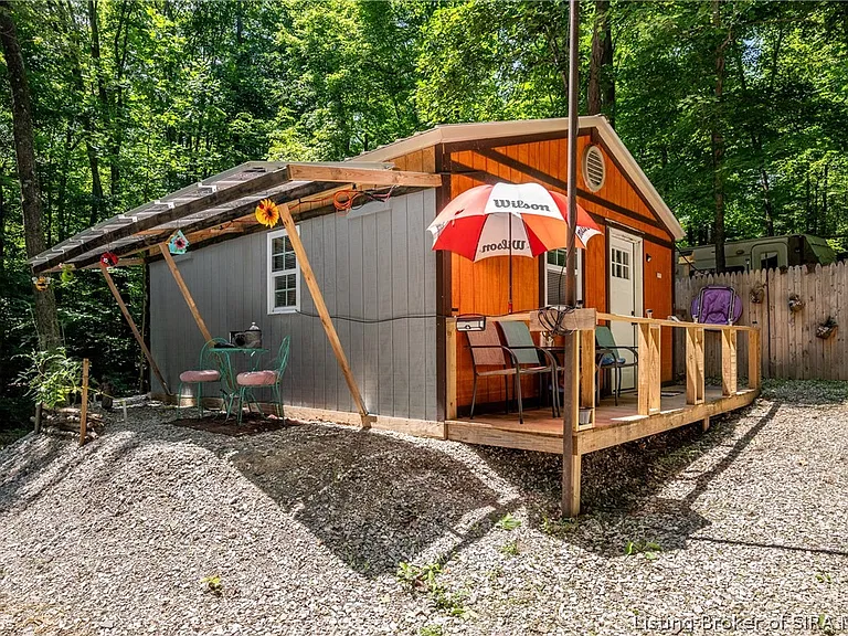 A Rustic Indiana Retreat With a Solar-Powered Cabin, Backup Generator & 3 Acres of Wooded Land