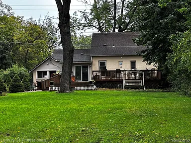 Rare Livonia Acreage Bungalow With Finished Lower Level and Private Outdoor Retreat