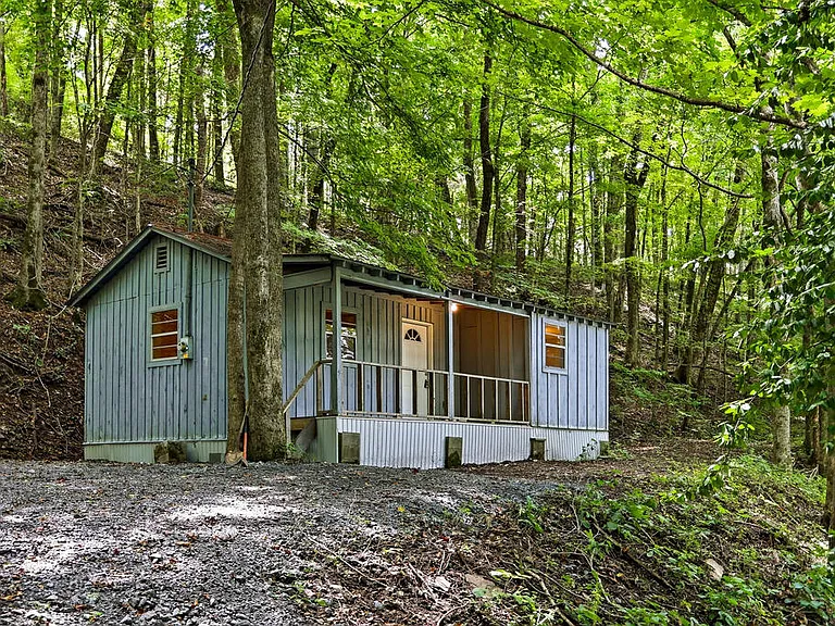 $122,500 Tennessee Cabin on 5 Acres With a Covered Porch, Modern Upgrades & Peaceful Woodland Views