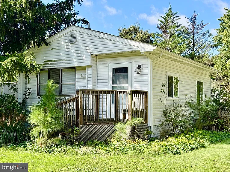 $80,000 Coastal Retreat in Lewes, Delaware — Furnished 2-Bedroom Home With Screened Porch, Deck, and Community Dock