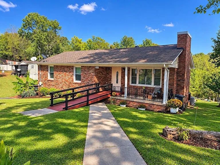 Spacious Brick Home in Collinwood with Multiple Living Areas and Room to Grow